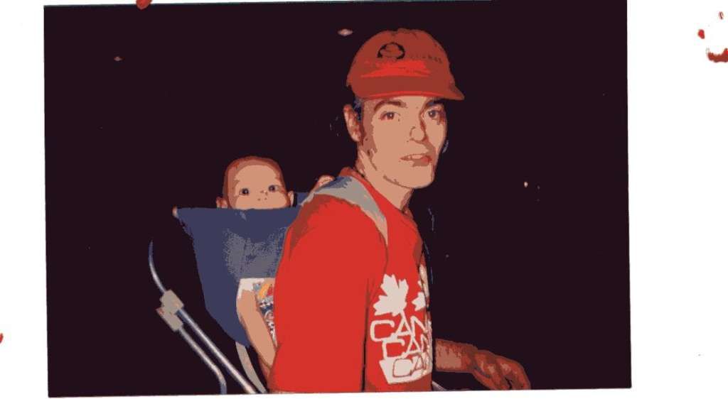 painting by Katy Gilbert from a nighttime photo of myself carrying no.3 son in a backpack wearing a Canada t-shirt.