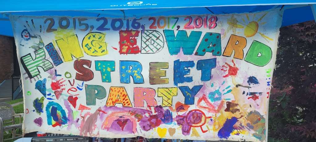 Hand painted sign for the annual community-organized street festival